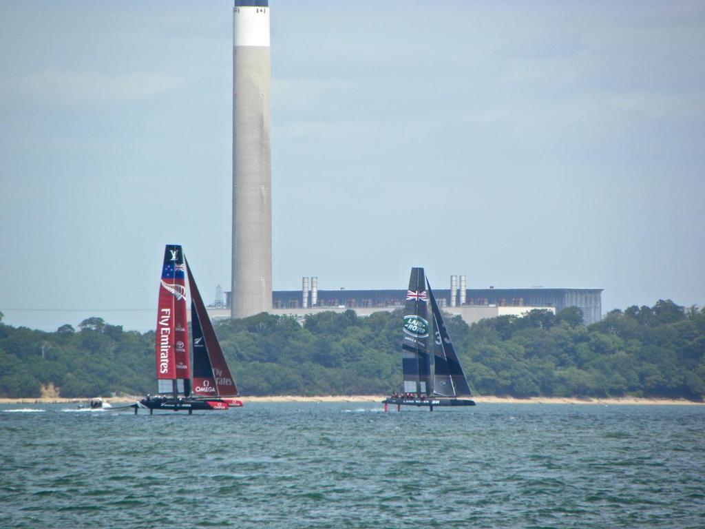 Emirates Team New Zealand and Ben Ainslie Racing line up off Cowes, Isle of Wight, June 29, 2015 © Pete Newlands